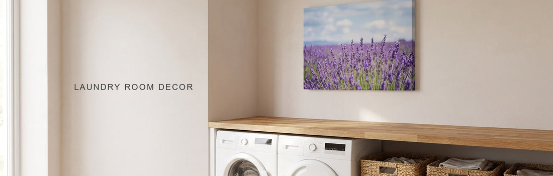 Laundry room decor ideas: a bright laundry room with a white washer and dryer under a butcher-block counter, woven baskets and a lavender field canvas on the wall