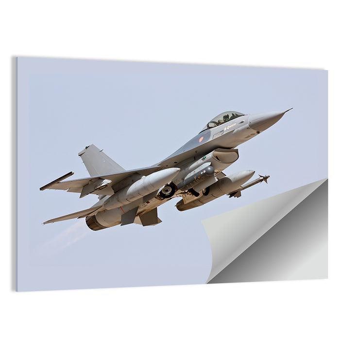 F-16 Fighter Jet Banking Over Sky Wall Art as a poster print