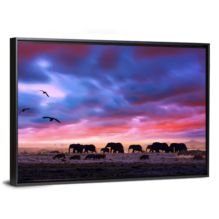 Elephants at Savannah Sunset Wall Art as a framed canvas