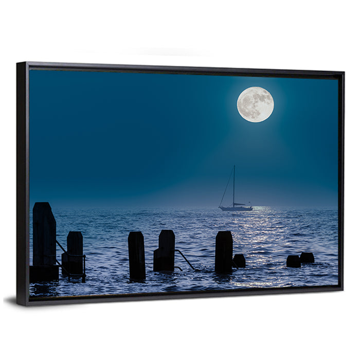 Moonlit Sailboat with Wooden Pylons Wall Art as a framed canvas