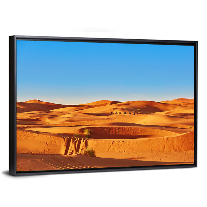 Sunlit Sahara Dunes with Camel Caravan Wall Art as a framed canvas