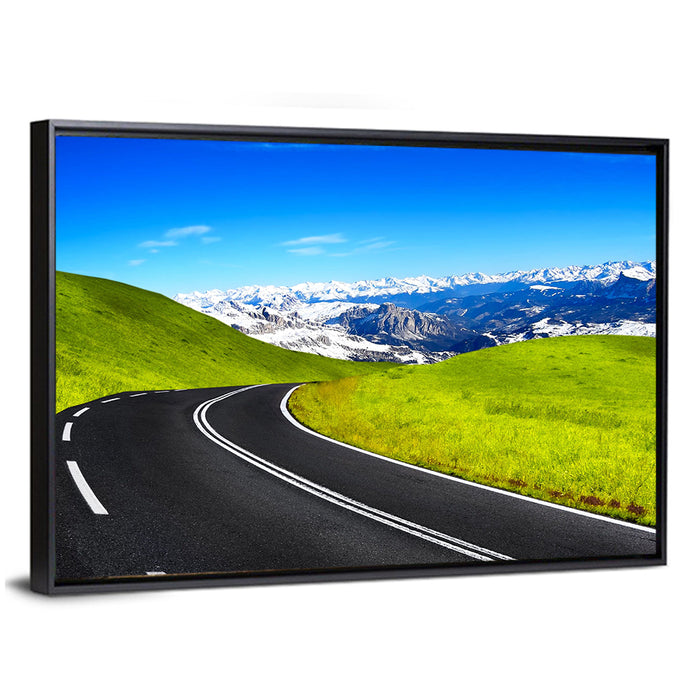 Winding Road Through Snow-capped Mountains Wall Art as a framed canvas