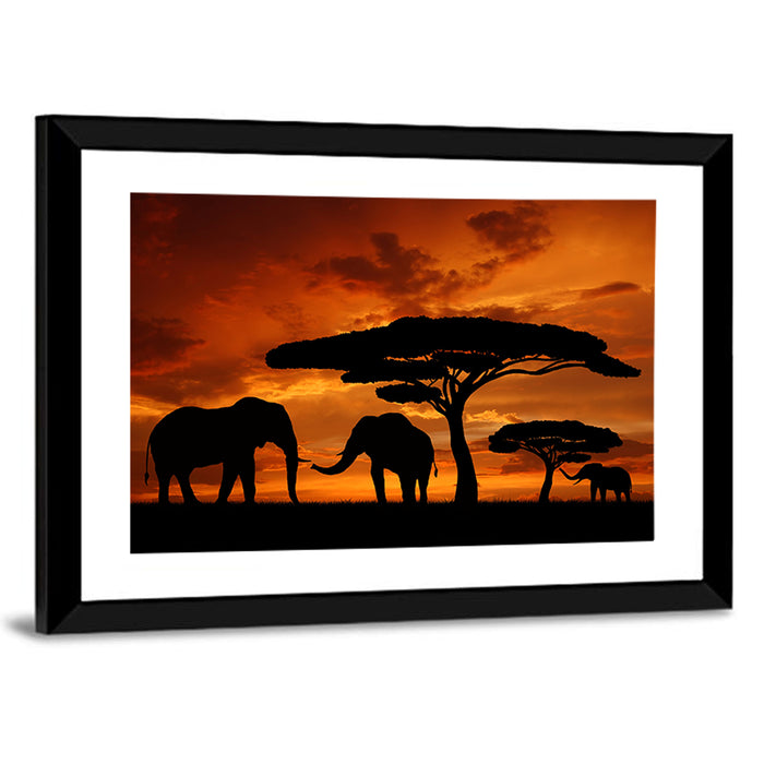 Three Elephants at Sunset Wall Art as a framed print