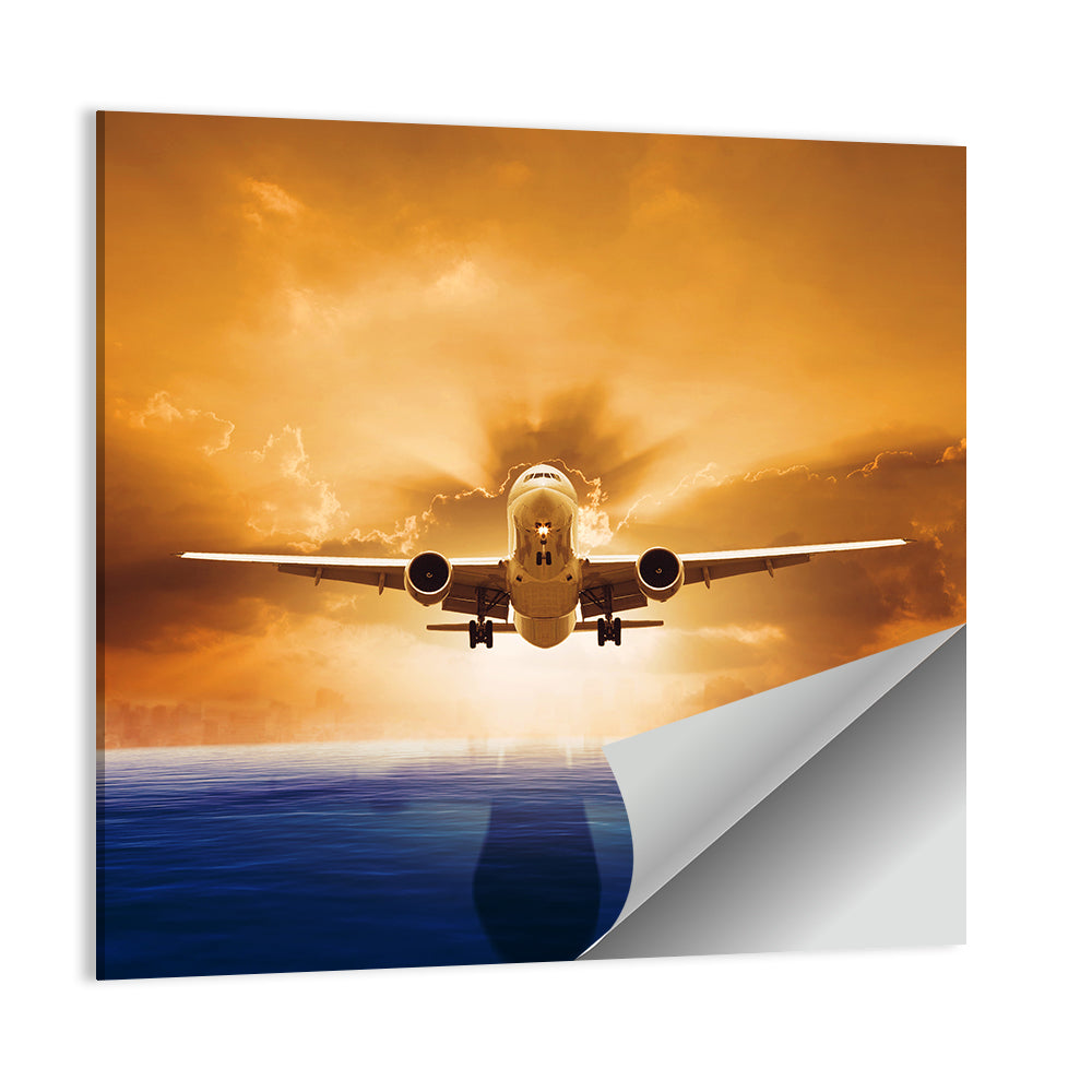 Landing Jet Over Ocean at Sunset Wall Art