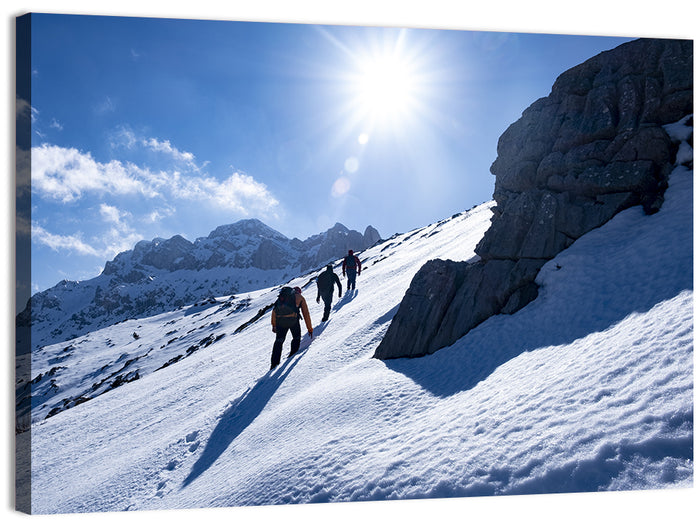 Ascending Mountaineers on Snowy Slope Wall Art as a canvas print