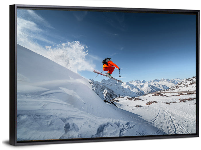 Airborne Skier Over Snowy Mountains Wall Art as a framed canvas