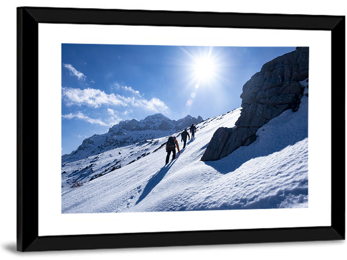 Ascending Mountaineers on Snowy Slope Wall Art as a framed print