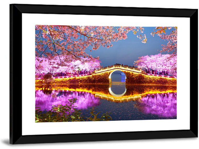Illuminated Cherry Blossom Bridge Wall Art as a framed print