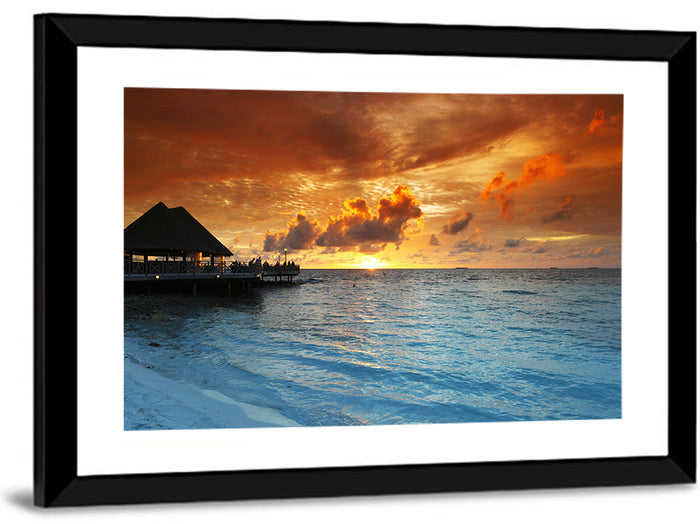 Overwater Bungalow Sunset Pier Wall Art as a framed print