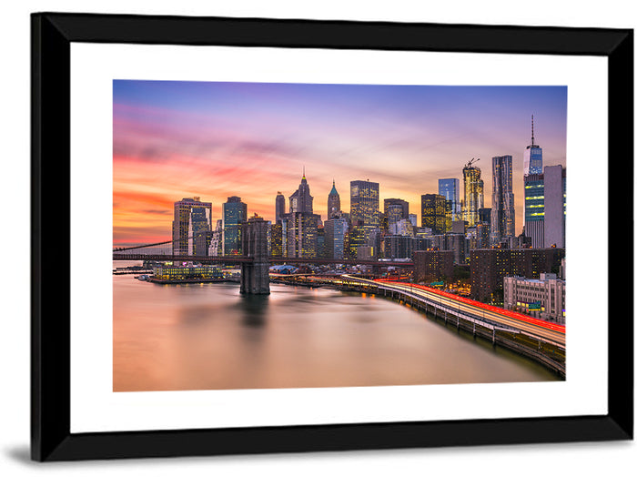 Brooklyn Bridge Light Trails Over Lower Manhattan Wall Art as a framed print