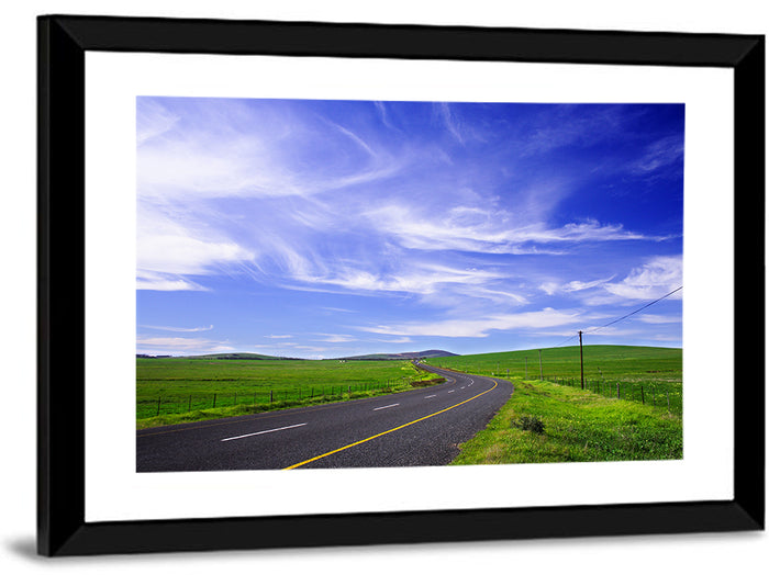 Winding Country Road in Green Fields Wall Art as a framed print