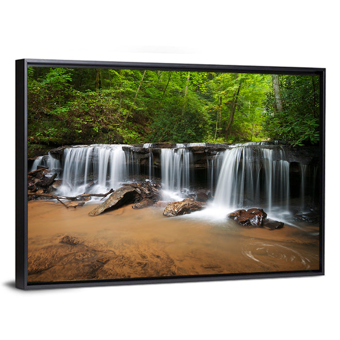 Lush Green Forest Waterfall Wall Art as a framed canvas