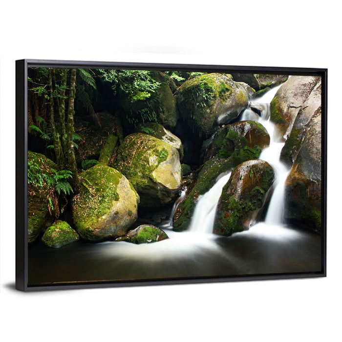Rainforest Waterfall with Moss Covered Boulders Wall Art as a framed canvas