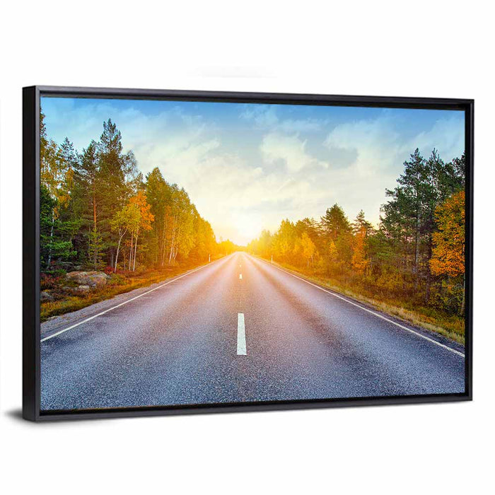 Sunlit Autumn Forest Road Wall Art as a framed canvas