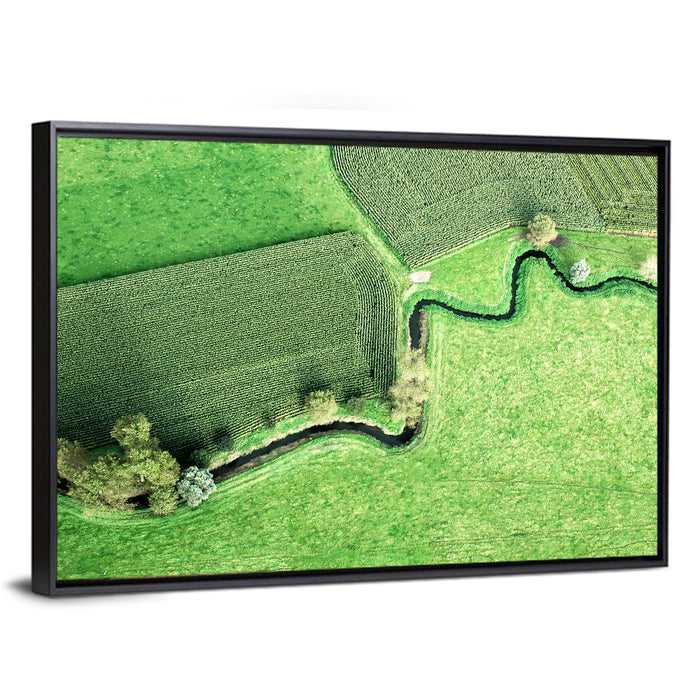 Meandering Stream Over Farmland Wall Art as a framed canvas