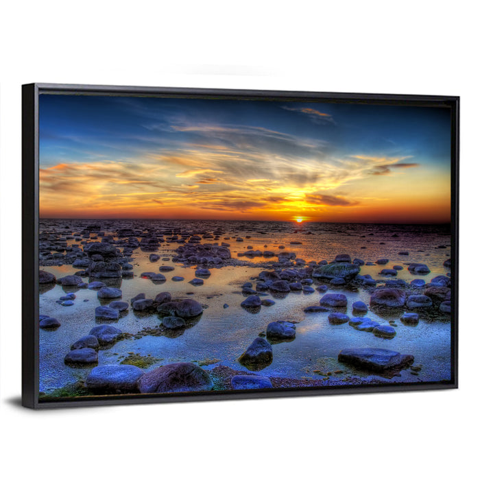 Sea Stones at Sunset Wall Art as a framed canvas