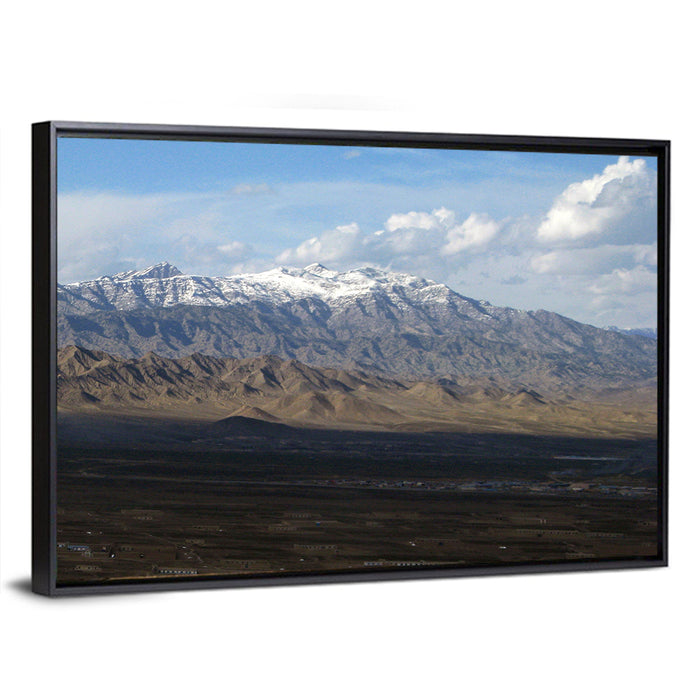 Snow-capped Afghan Mountains Wall Art as a framed canvas