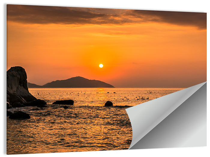 Orange Sunrise Over Rocky Coast Wall Art as a poster print