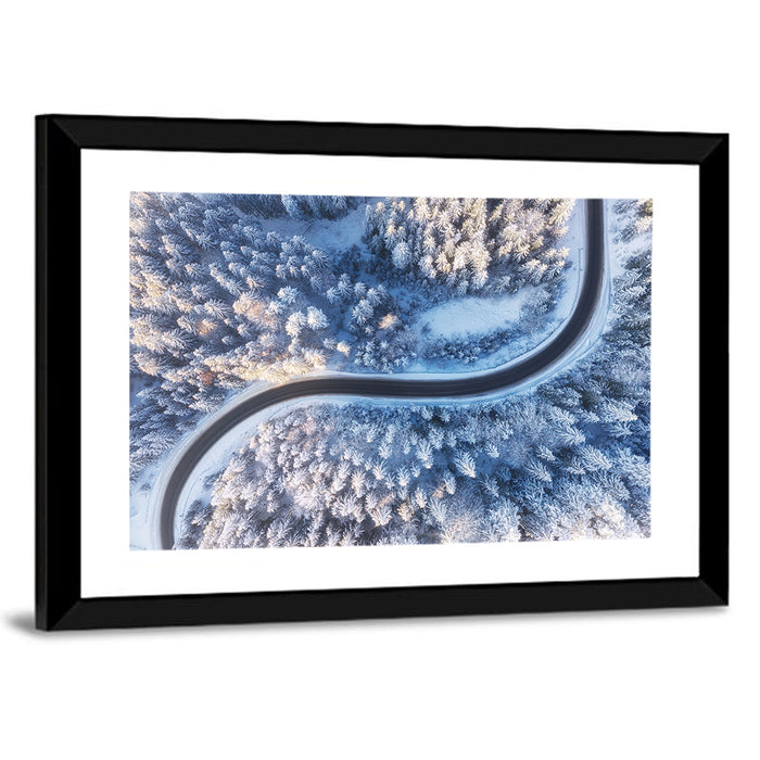 Winding Snow-covered Forest Road Wall Art as a framed print