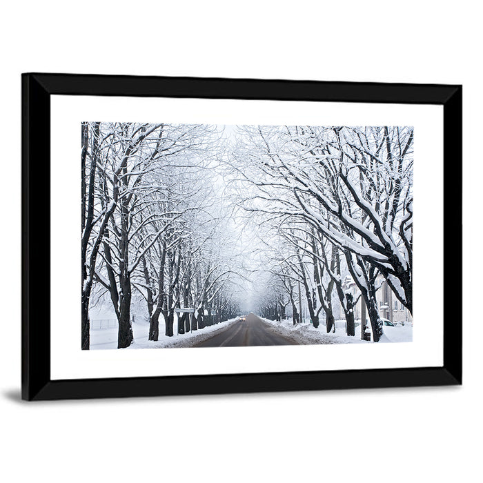 Snowy Road with Distant Headlights Wall Art as a framed print