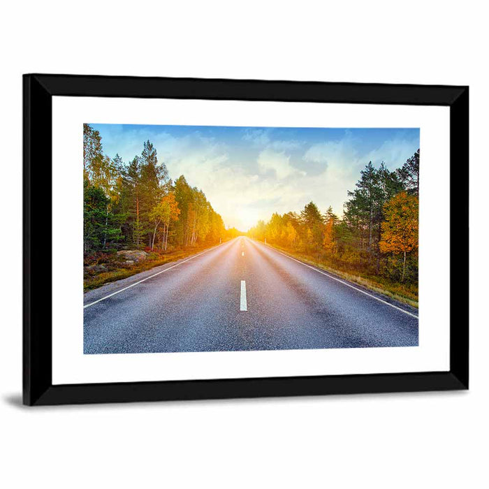 Sunlit Autumn Forest Road Wall Art as a framed print