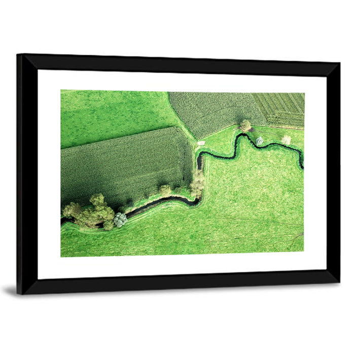 Meandering Stream Over Farmland Wall Art as a framed print