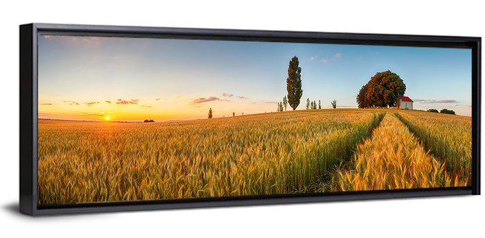 Sunset Wheat Field with Red Roof Cottage Wall Art as a framed canvas