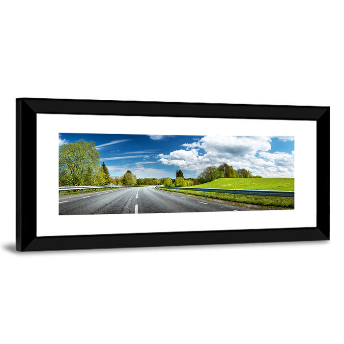 Sunlit Asphalt Road Wall Art as a framed print