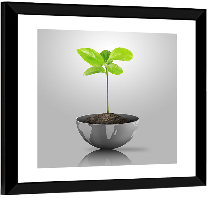 Young Plant on Globe Wall Art as a framed print