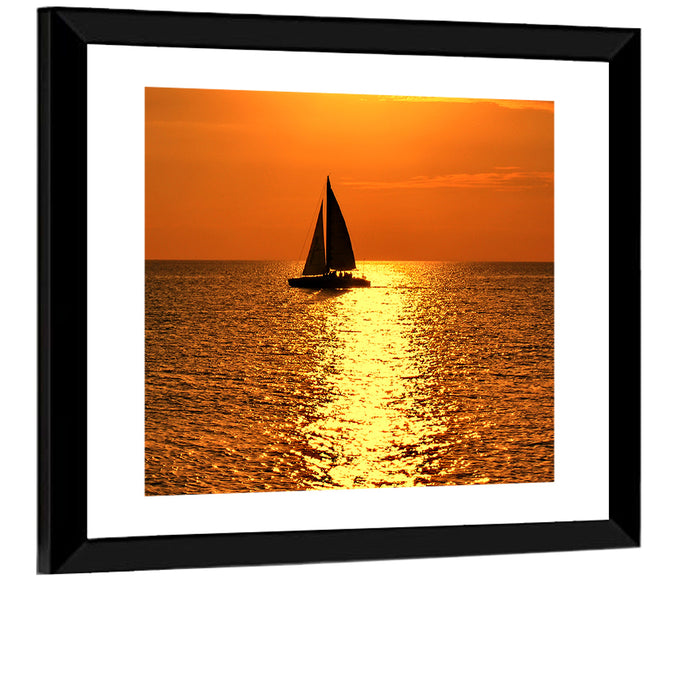 Sailboat Silhouette at Golden Sunset Wall Art as a framed print