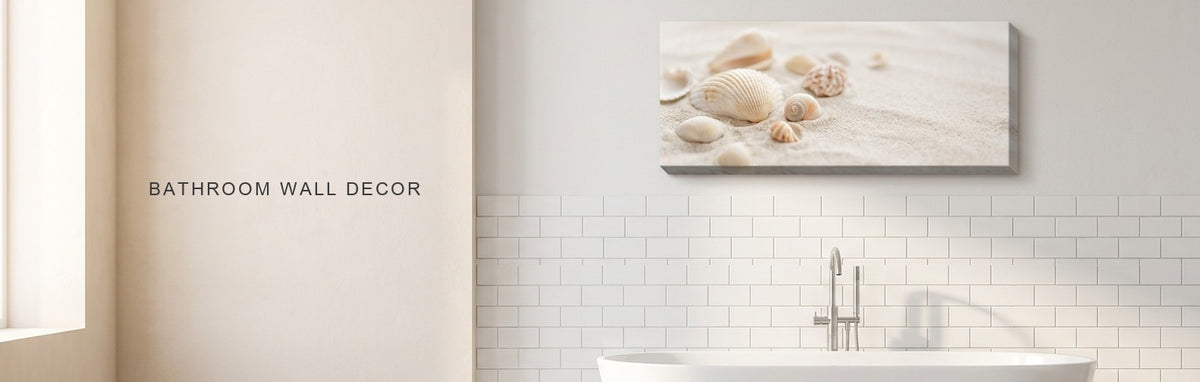 Bathroom wall decor in a bright bathroom with a freestanding tub and white tile: a soft coastal seashell canvas on the wall