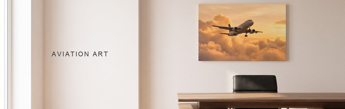 Aviation art: a modern home office with a walnut desk and a black leather chair, with a passenger jet climbing through golden clouds at sunset on a canvas behind the desk