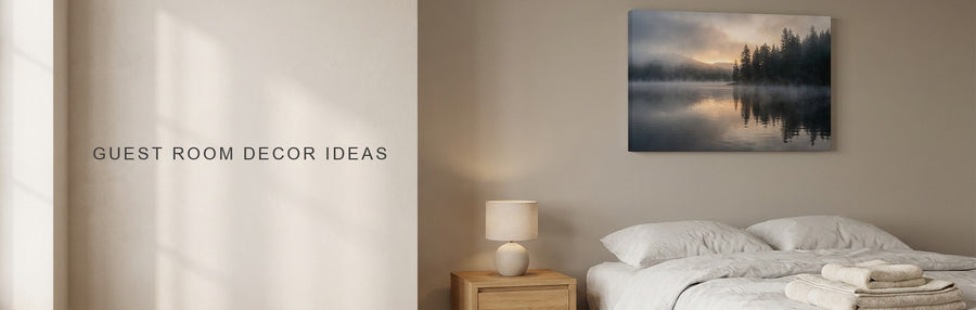 Guest room decor ideas: a calm guest bedroom with a white linen bed, an oak nightstand and a misty lake canvas on the wall beside the bed
