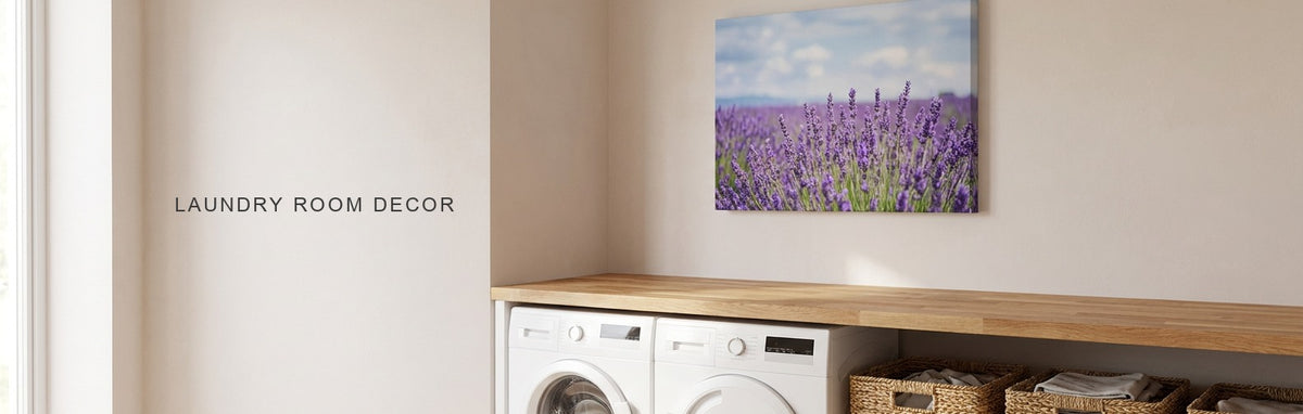 Laundry room decor ideas: a bright laundry room with a white washer and dryer under a butcher-block counter, woven baskets and a lavender field canvas on the wall