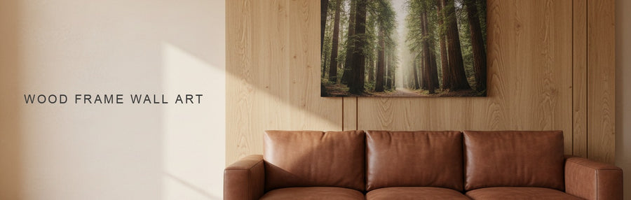 Wood frame wall art idea: a tall redwood forest canvas in a living room with oak wall paneling and a leather sofa
