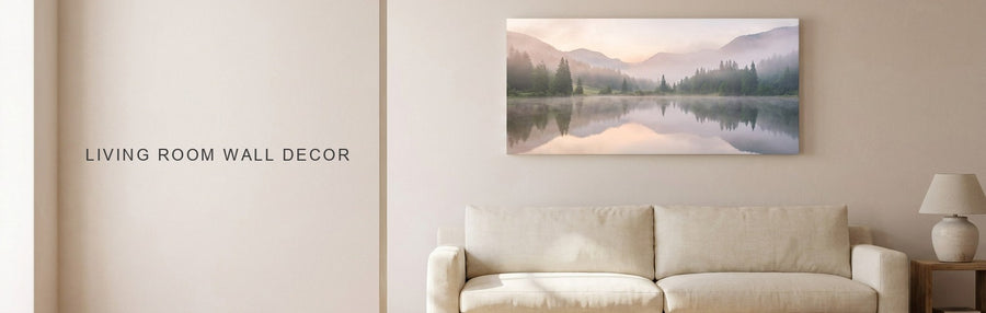 Living room wall decor ideas in a bright living room: a misty mountain lake canvas above a long cream sofa