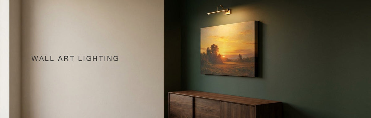 Wall art lighting in a dark green living room at dusk: a brass picture light over a warm golden sunset canvas