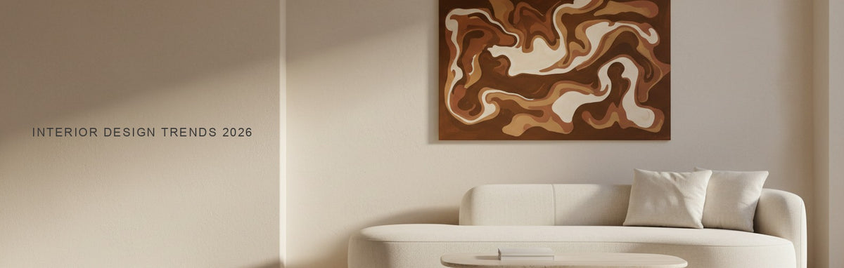 Interior design trends 2026 in a modern organic living room: curved boucle sofa, travertine table and a warm brown and cream abstract canvas
