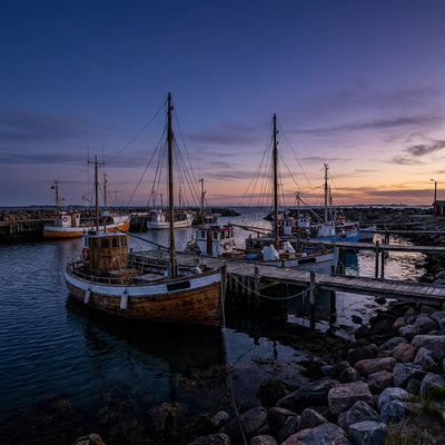 Harbor wall art, a harbor at dusk with moored boats