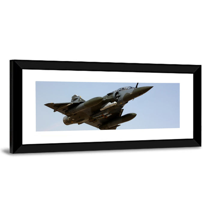 Camouflaged Fighter Jet in Flight Wall Art as a framed print