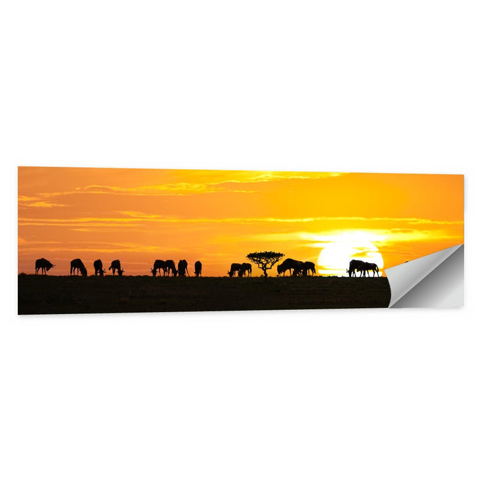 Wildebeest Silhouettes at Sunset Wall Art as a poster print