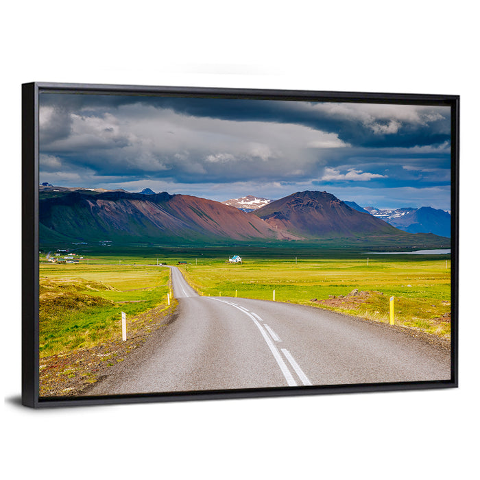 Icelandic Winding Road Toward Mountains Wall Art as a framed canvas