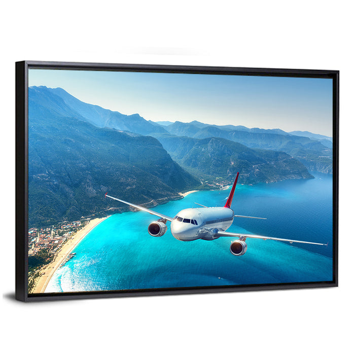 Airplane Over Turquoise Coast Wall Art as a framed canvas