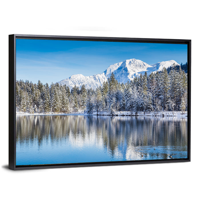 Snow Covered Alpine Lake Reflection Wall Art as a framed canvas