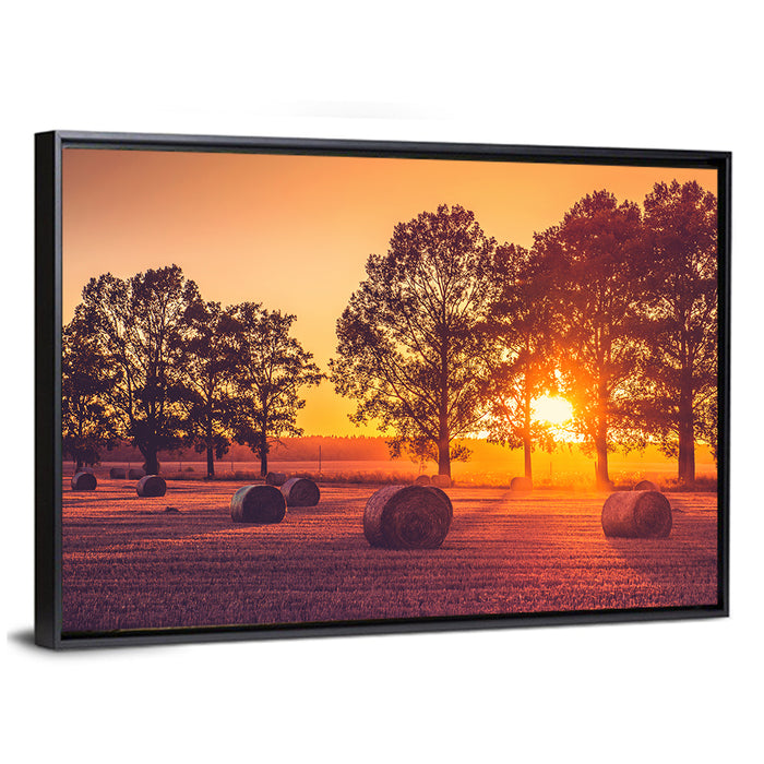 Sunset Over Hay Bales Wall Art as a framed canvas