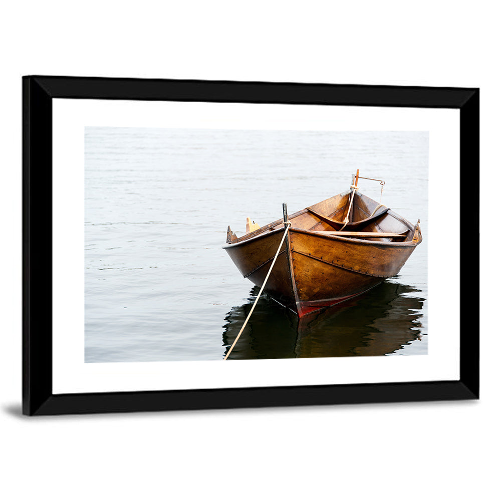 Tethered Wooden Rowboat on Calm Water Wall Art