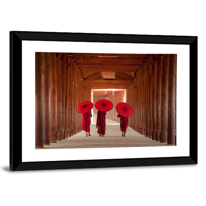 Novice Monks with Red Umbrellas Wall Art as a framed print