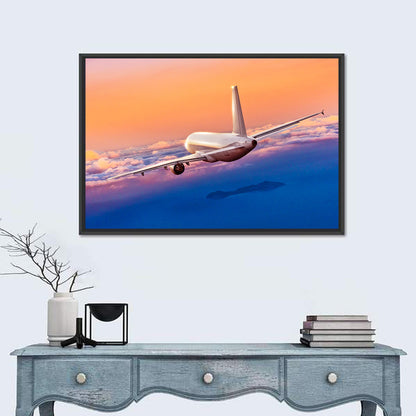 Airplane Over Clouds at Sunset Wall Art