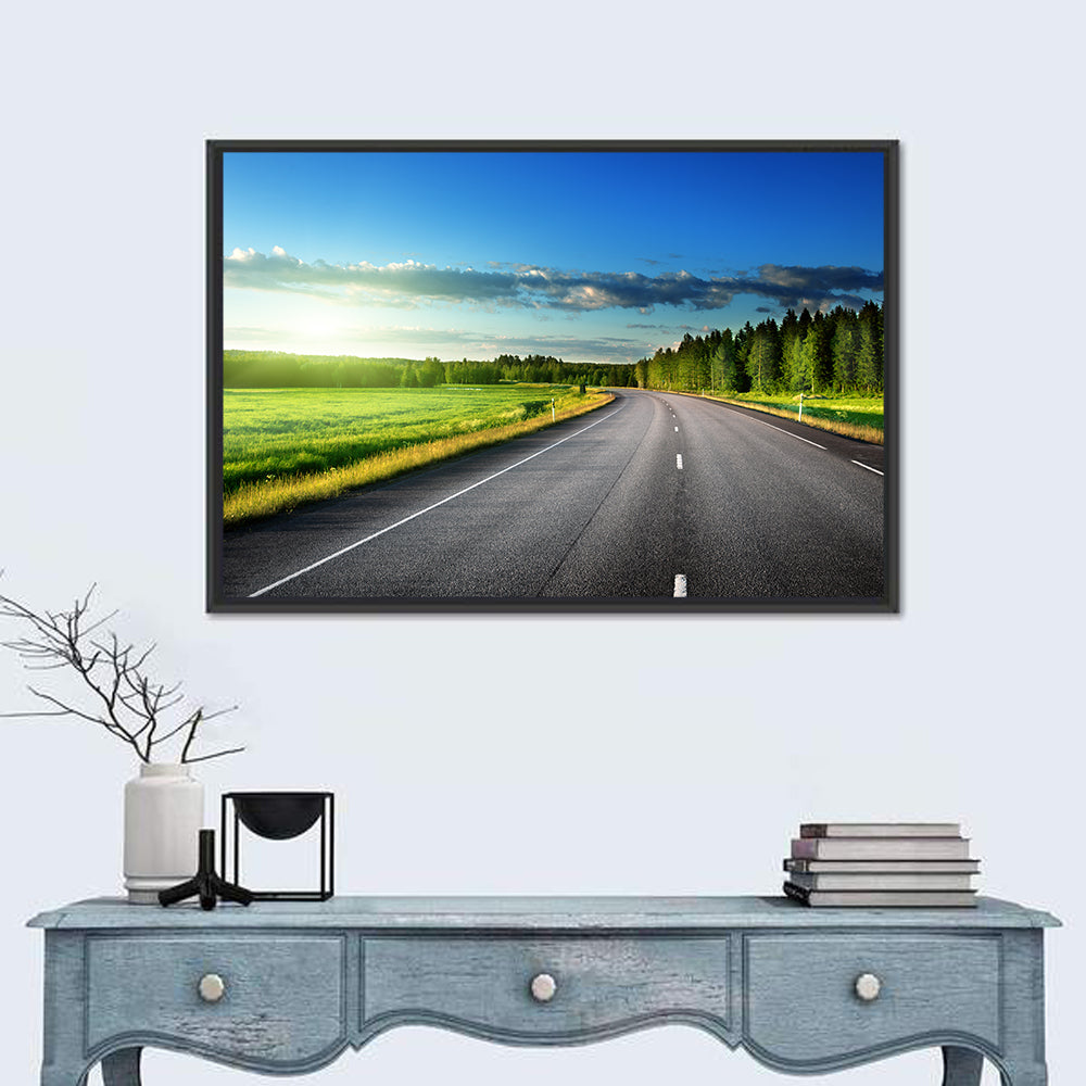 Curved Asphalt Road Through Forest Wall Art in a room, landscape