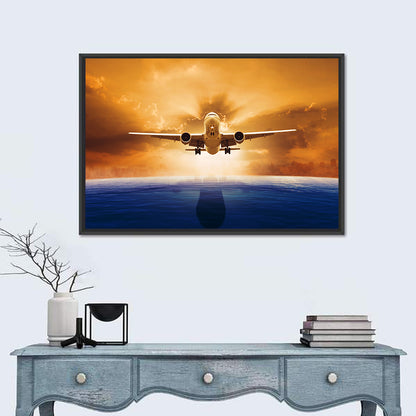 Landing Jet Over Ocean at Sunset Wall Art